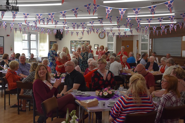 People enjoying an afternoon tea at Pinxton Village Hall