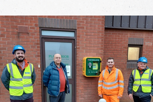 Pictured is Cllr Munro (2nd from the left) with representatives from Robert Woodheads Ltd and Planterior proudly showing off the new Defib